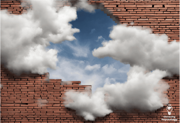 Clouds blocked by a red brick wall with a hole in it showing blue sky.